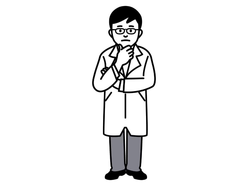 腕を組んで考える白衣を着た男性